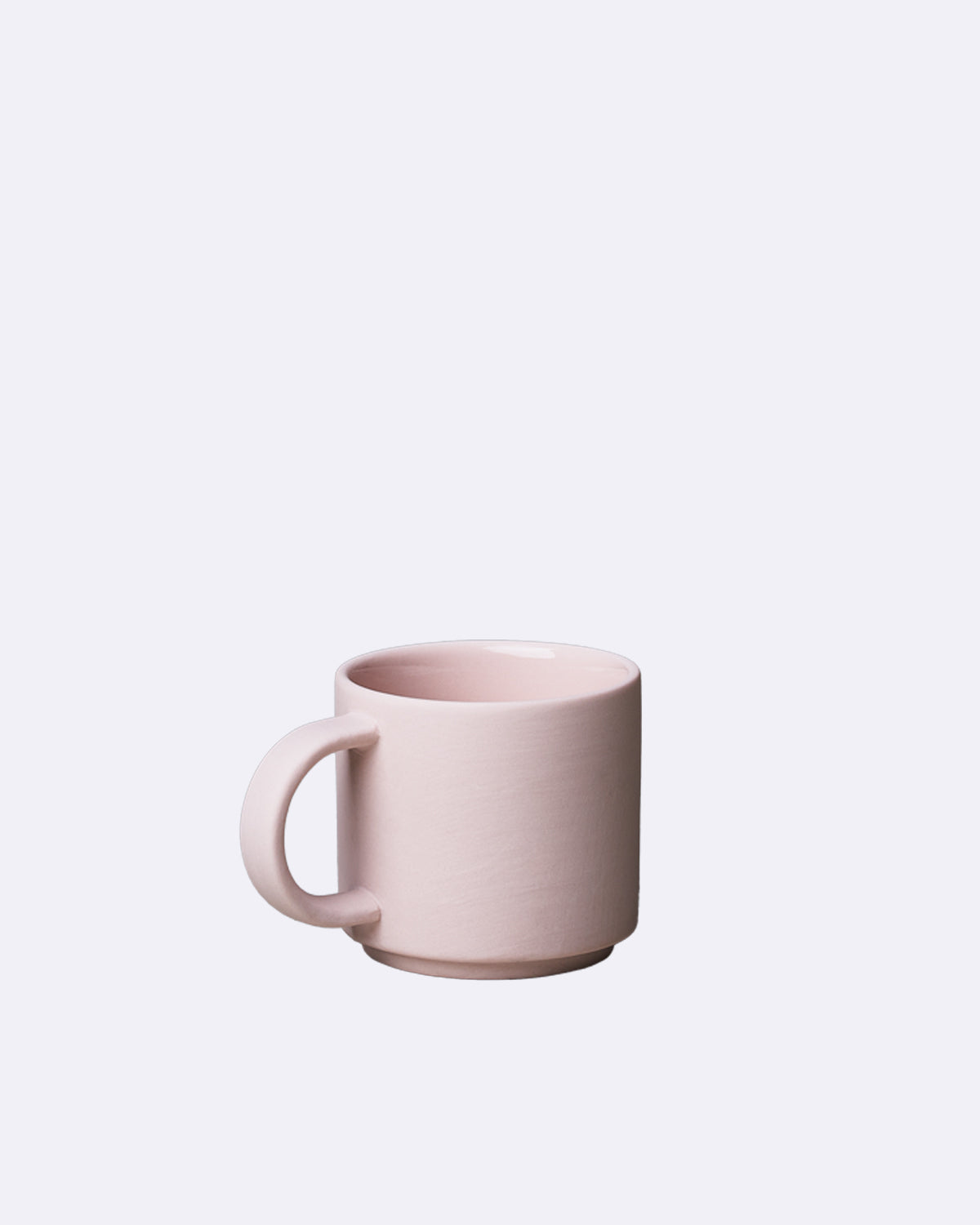Espressotasse aus Porzellan in zartem Rosa ohne sichtbaren Schriftzug