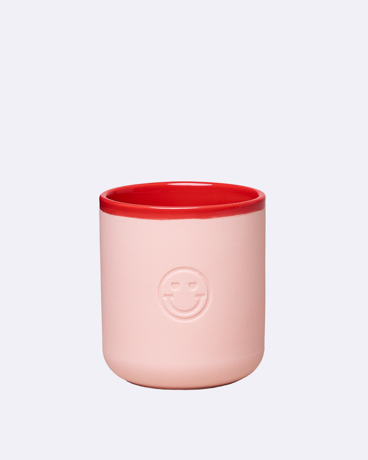 Porzellantasse in Rosa mit rotem Rand und lachendem Gesicht-Emblem
