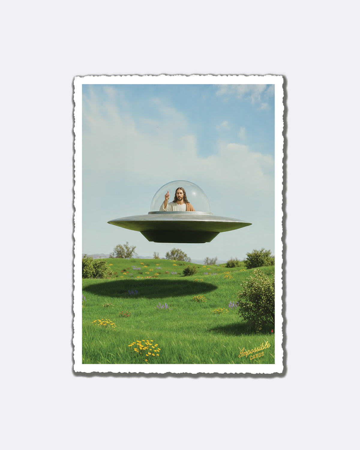 Postkarte mit Jesus in UFO über einer blühenden Wiese und Schriftzug "Impossible Cards"