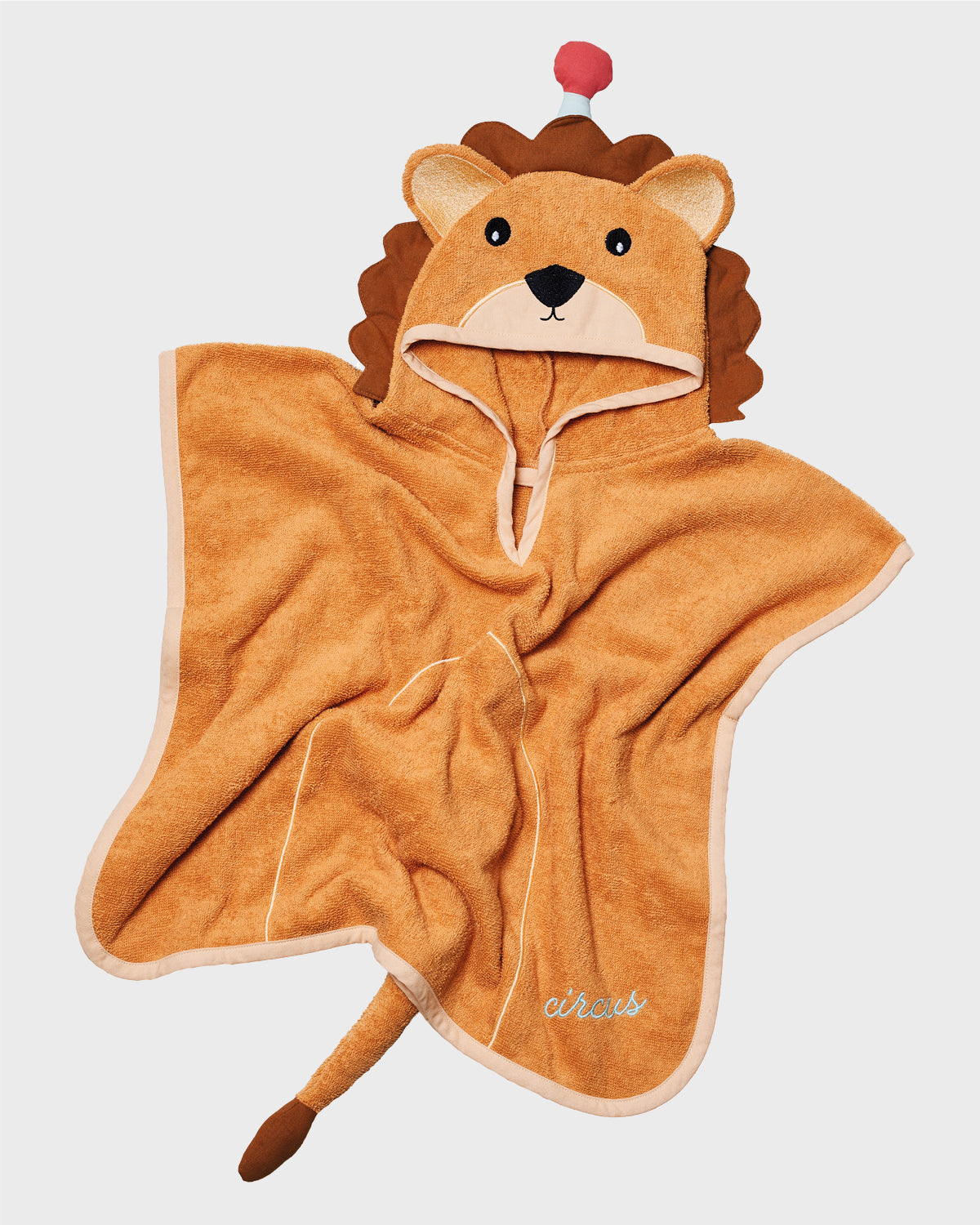 Kinder-Poncho aus Frottee in Braun mit Löwengesicht und Mähne, Schriftzug "circus in Blau"
