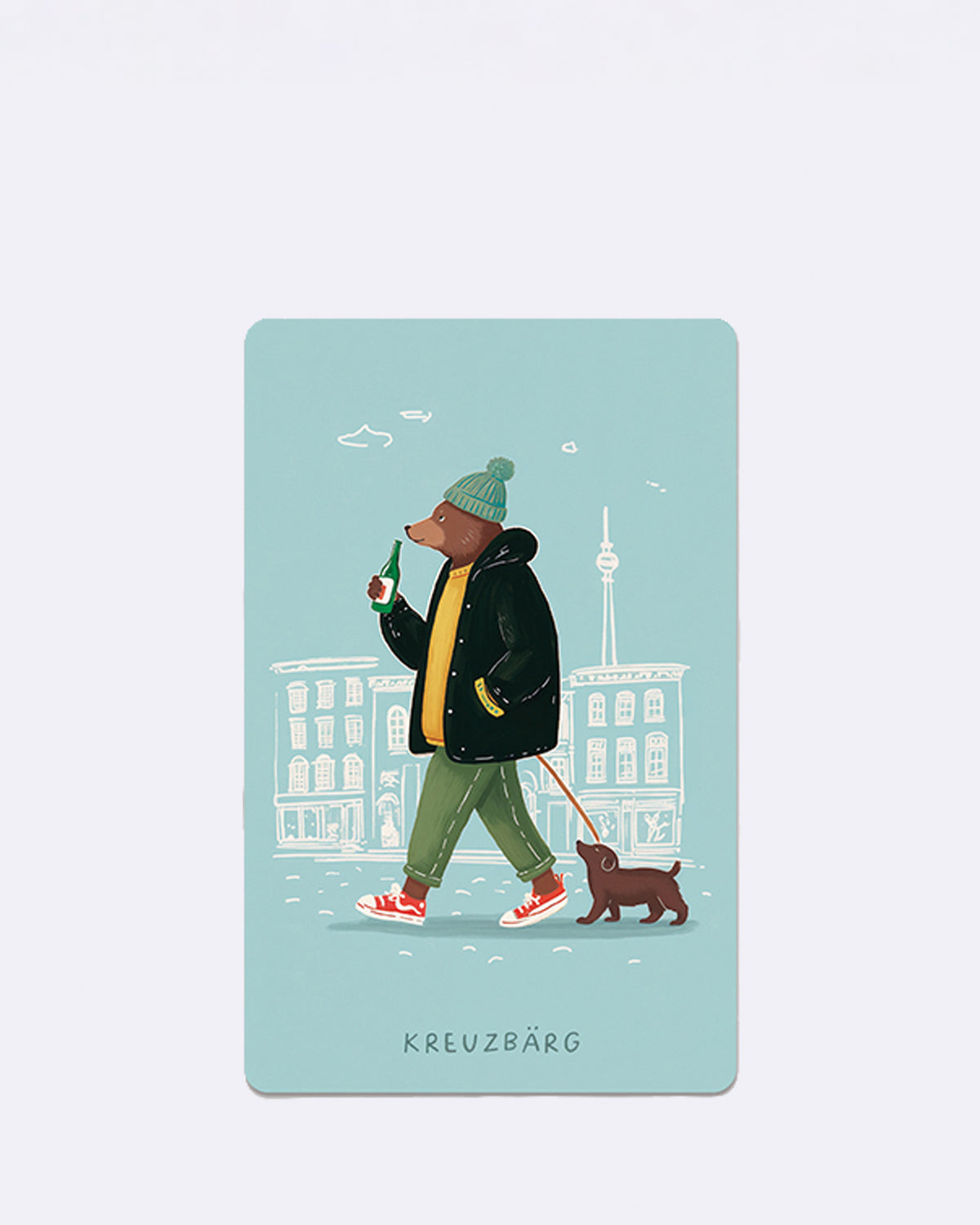 Postkarte mit einem illustrierten Bären und Hund vor blauen Gebäuden mit Schriftzug "KREUZBÄRG"
