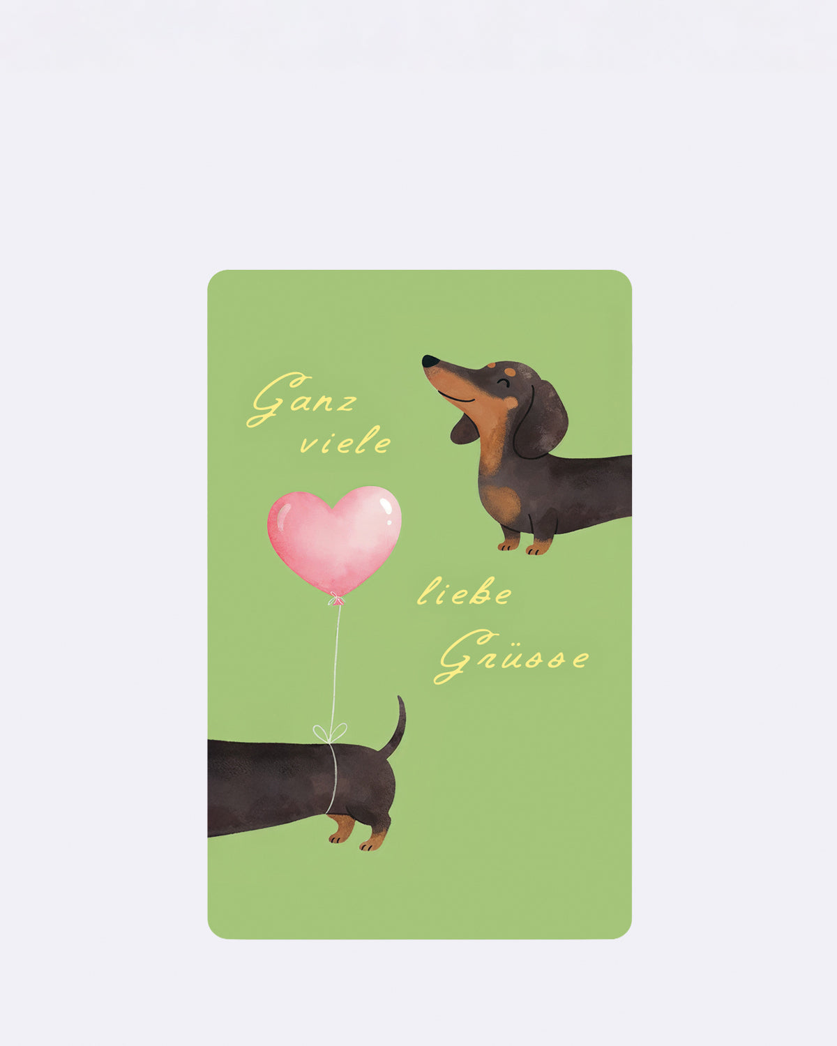 Postkarte mit Dackelmotiv auf grünem Hintergrund und Schriftzug "Ganz viele liebe Grüsse"